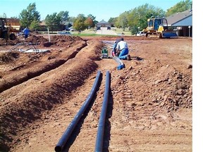 These pipes are being installed as part of a ground source heat pump installation. Heat pumps like these extract heat from the earth, delivering about three times as much energy as the electricity they consume.