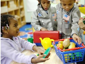 umou Balde, 4, left, plays with her teacher Jacqualine Sanchez in a pre-kindergarten class designed to educate children about nutrition and health.