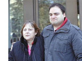 With his arm around his mother, Connie, Kevin Martin leaves the courthouse Monday.
