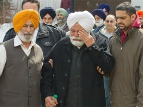 Ajit Singh, father of Jagtar Gill, is overcome with emotion as he leaves the courthouse Monday.