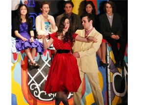 Annie Maglieri, performs as Cha Cha (L), and Brendan Davey, performs as Danny Zuko (R), during All Saints Catholic High School’s Cappies production of Grease.