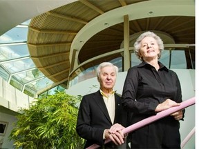 Bill and Jean Teron stand on the glass staircase that leads to the circular study in this 2013 photo. The study roof is the only part of the home not covered with a garden.