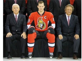 GM Bryan Murray, Jason Spezza and Eugene Melnyk in position for the annual photo as the Ottawa Senators practice at Canadian Tire Centre on April 29, 2014.