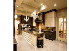 Chantal St. Amour and Dean Large of Astro Design Centre made the most of a long but narrow kitchen by creating a galley-like space rich in tone and texture with the use of a large mixture of woods, metal and stones.