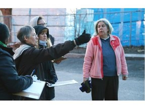 Cheryl Parrott, second from left, co-chair of the Security Committee for the Hintonburg Community Association, guides an audit with volunteers on Bayview Road that will look at the safety for pedestrians in preparation for the diversion of 2,500 buses a day onto Scott and Albert Streets.