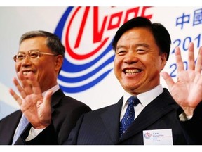 Kin Cheung/the associated press
 Chairman Wang Yilin, right, and CEO and president Li Fanrong were behind the China National Offshore Oil Corporation’s $15.1-billion takeover of the Calgary-based oil company Nexen, Inc.