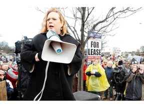 Conservative MPP Lisa MacLeod addresses the crowd at a protest outside Liberal Energy Minister Bob Chiarelli’s office in Ottawa on Friday.