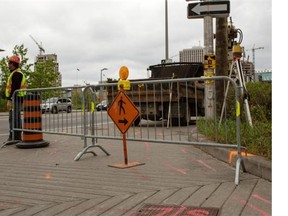 Construction crews began work to widen a section of Laurier Avenue between Nicholas Street and Waller Street to accomodate OC Transpo buses ahead of Ottawa’s LRT construction on Tuesday, May 21, 2013. Leslie Schachter/Ottawa Citizen