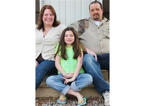 Emily Cryderman, pictured last fall with her parents, Carie and Steve Cryderman. Kelly was injured at the TraveLodge on Carling Avenue in March in a mishap that released chlorine gas into the pool area.