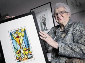 Irma Trottier has donated art by her late husband, Gerald, to the Ottawa Art Gallery. She holds a favourite piece, The Resurrection.