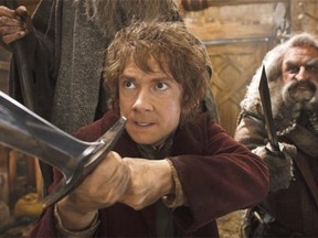 Bilbo Baggins (Martin Freeman, left, with John Callen) forges ahead to a spectacular showdown with the titular dragon in The Hobbit: The Desolation of Smaug.