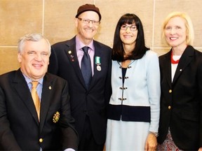 From left, Ontario Lt. Gov. David Onley with Arnie Vered, recipient of an Ontario Medal for Good Citizenship, and his wife, Liz Vered, and Roseann Runte, president and vice-chancellor of Carleton University, at Vered’s investiture held at Carleton University on Saturday, April 12, 2014.