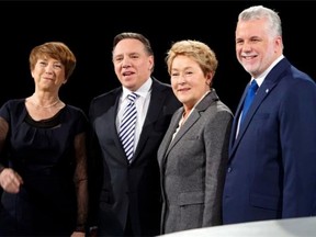 From left, Quebec Solidaire Leader Francoise David, Coalition Avenir du Quebec Leader Francois Legault, Parti Quebecois leader Pauline Marois, and Liberal leafer Philippe Couillard pose for photos before the first debate of the election campaign Thursday, March 20, 2014 in Montreal. Quebecers will vote in a provincial election April 7, 2014.THE CANADIAN PRESS/Ryan Remiorz