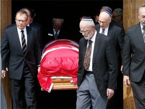 Herb Gray’s  casket is carried out of Congregation Machzikei Hadas.