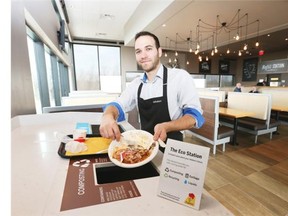 St.-Hubert is working hard to go green all the way, says manager Lucas Indri of St. Hubert of the restaurant ‘s Eco Station designed for composting.