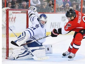 James Reimer (L) had Milan Michalek to deal with in the third period as the Ottawa Senators take on the Toronto Maple Leafs in NHL action at Canadian Tire Centre in Ottawa. Photo taken on April 12, 2014.