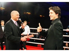 Justin Trudeau, right, said his wife scolded him for publicly swearing at a boxing match over the weekend.