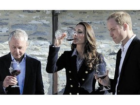 The Duchess and Duke of Cambridge take part in wine-tasting with coowner John Darby during a visit to the Amisfield Winery in Queenstown.