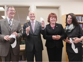 Mayor Jim Watson, U.S. Ambassador Bruce Heyman, Coun. Jan Harder and Vicki Heyman cut the ribbon on Wednesday to celebrate the Imagine Space: An American Corner at the Ottawa Public Library Centrepointe Branch.