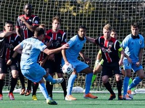 Minnesota United FC player Kevin Venegas takes a free kick against Ottawa Fury FC during the first home game in Ottawa at Keith Harris Stadium on Saturday, April 19, 2014. Fury FC would lose on another free kick later in the game. (James Park/Ottawa Citizen)