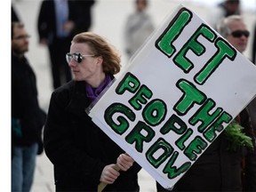 Cannabis activists hold a rally on Parliament Hill in Ottawa on Tuesday, April 1, 2014 to protest the government's new Marijuana for Medical Purposes Regulations.