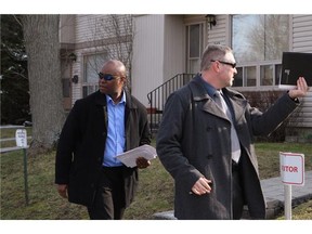 RCMP investigators canvass the neighbourhood around the house of Stephen Arthuro Solis-Reyes, 19, in London, Ont., in London, Ontario on Wednesday, April 16, 2014.