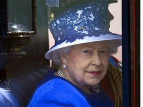 Britain's Queen Elizabeth II rides in a carriage on her way to the Queen's Birthday Parade, 'Trooping the Colour,' at Horse Guards Parade in London on June 15, 2013. The ceremony of Trooping the Colour is believed to have first been performed during the reign of King Charles II. In 1748, it was decided that the parade would be used to mark the official birthday of the Sovereign. More than 600 guardsmen and cavalry make up the parade, a celebration of the Sovereign's official birthday, although the Queen's actual birthday is on 21 April.