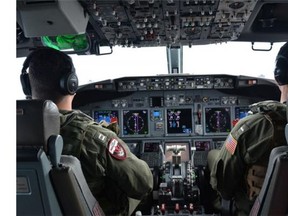 Naval aviators assigned to assist in search and rescue operations for Malaysia Airlines flight MH370.