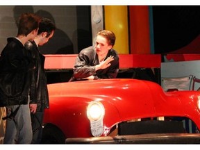 Nicholas Dehler, performs as Doody (L), Brendan Davey, performs as Danny Zuko (M), and Brandyn Coulas, performs as Kenickie (R), during All Saints Catholic High School’s Cappies production of Grease.