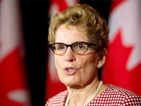 Ontario Premier Kathleen Wynne answers questions n Toronto on Monday April 7, 2014. THE CANADIAN PRESS/Frank Gunn