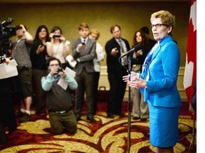 Ontario Premier Kathleen Wynne speaks to reporters following her announcement of a $29-billion plan over the next 10 years for transit and transportation infrastructure in Ontario.