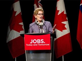 Ontario Premier Kathleen Wynne speaks to a theatre audience in Port Hope about her vision for creating jobs and growing the economy in Eastern Ontario Friday, February 7, 2014. THE CANADIAN PRESS/Galit Rodan