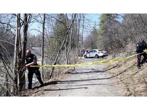 Ottawa police tape off an area in Hog’s Back Park after a body was found on Thursday afternoon.