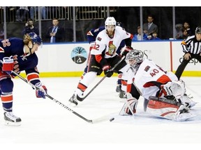 Ottawa Senators goalie Robin Lehner (40) stops a shot on the goal by New York Rangers’ Carl Hagelin (62) during the second period of an NHL hockey game, Saturday, April 5, 2014, in New York.