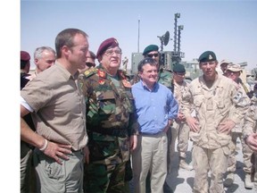 Peter MacKay, then-minister of defence, Abdul Rahim Wardak, Afghan Minister of Defence, Jim Flaherty, then minister of finance, and Brig.-Gen. Denis Thompson at the Kandahar Air Field in Afghanistan Aug. 26, 2008.
