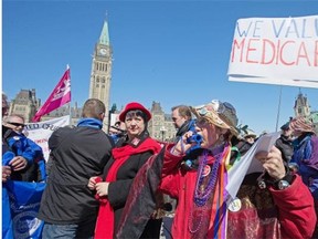 The Raging Grannies join various union organizations on Parliament Hill on Monday to mark the end of the national health accord and call for new federal leadership on medicare.