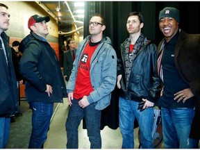 Redblacks players, left to right, John Delahunt, Kevin Scott, Justin Phillips, Simon LeMarquand and Henry Burris joke around prior to an appearance before an Ottawa 67’s game at Canadian Tire Centre in February. Most of the 73 players under contract with the team will meet for the first time at mini-camp in Virginia next week.