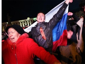 SIMFEROPOL, UKRAINE - MARCH 16: People in Lenin Square attend a pro Russian rally after a day of voting on March 16, 2014 in Simferopol, Ukraine. Photo by Spencer Platt/Getty Images