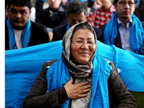 In this photo taken on Monday, March 17, 2014, Afghan vice presidential candidate, Habiba Sarabi, greets her supporters during a campaign rally in Kabul, Afghanistan. Sarabi, who already has been the first female governor in Afghanistan, is the most prominent woman running on a ticket in the April 5 election that will mark the first democratic transfer of power since the 2001 U.S.-led invasion that ousted the Taliban. But she faces cultural norms in this deeply conservative Islamic society. (AP Photo/Massoud Hossaini)