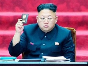 In this Wednesday, April 9, 2014 image made from video, North Korean leader Kim Jong Un holds up parliament membership certificate during the Supreme People’s Assembly in Pyongyang, North Korea. AP Photo/KRT via AP Video