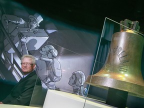 Curator John Willis with the ship's bell and animation in the Empress of Ireland exhibit at the Canadian Museum of History. (Photo by Chris Mikula, Ottawa Citizen)