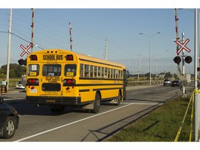 OTTAWA, ONT., SEPT 19, 2013--CRASH FOLLOW This school bus made a complete stop at the train tracks on Woodroffe Ave where Wednesday's bus-train accident at Woodroffe and the VIA train crossing occurred. (Pat McGrath/The Ottawa Citizen) CITY staff stories ASSIGNMENT #114485 SAXO--0920-city-crash VIDEO--YES (Scott Parker) ORG XMIT: POS1309191326237993