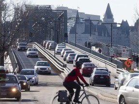 Morning rush hour traffic coming into downtown Ottawa from the Gatineau side of the Ottawa River over the Alexandra Bridge.