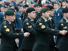 Veterans of the Afghanistan war march on Wellington Ave during the National Day of Honour on Parliament Hill.  Photo taken on May 9, 2014. (Photo by Wayne Cuddington/ Ottawa Citizen)