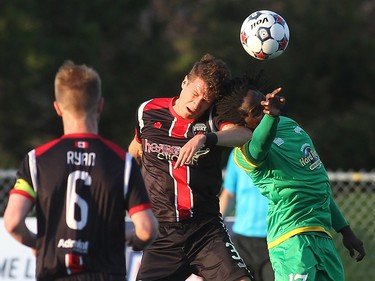 Ottawa Fury FC's Mason Trafford takes a header from Tampa Bay Rowdies' Lucky Mkosana during NASL action on Saturday, May 10, 2014 at Carleton University.