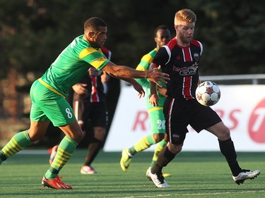 Ottawa Fury FC's Richie Ryan avoids Tampa Bay Rowdies' Darel Russell during NASL action on Saturday, May 10, 2014 at Carleton University.