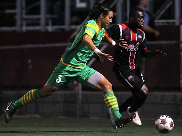 Ottawa Fury FC's Hamza Elias battles with Tampa Bay Rowdies' Willie Hunt during NASL action on Saturday, May 10, 2014 at Carleton University.