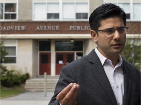 Liberal MPP Yasir Naqvi speaks to reporters outside Broadview Public School in this May 14 photo.