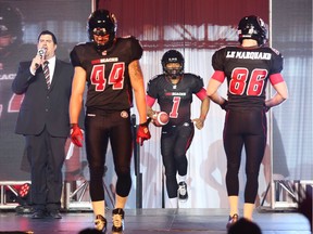 #44, Justin Phillips #1 Henry Burris and Simon Le Marquand of the Ottawa Redblacks of the CFL unveil their uniform, May 06, 2014.