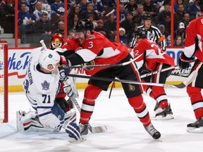OTTAWA, ON - DECEMBER 7: Marc Methot #3 of the Ottawa Senators checks David Clarkson #71 of the Toronto Maple Leafs to the ice during an NHL game at Canadian Tire Centre on December 7, 2013 in Ottawa, Ontario, Canada.  (Photo by Jana Chytilova/Freestyle Photography/Getty Images)